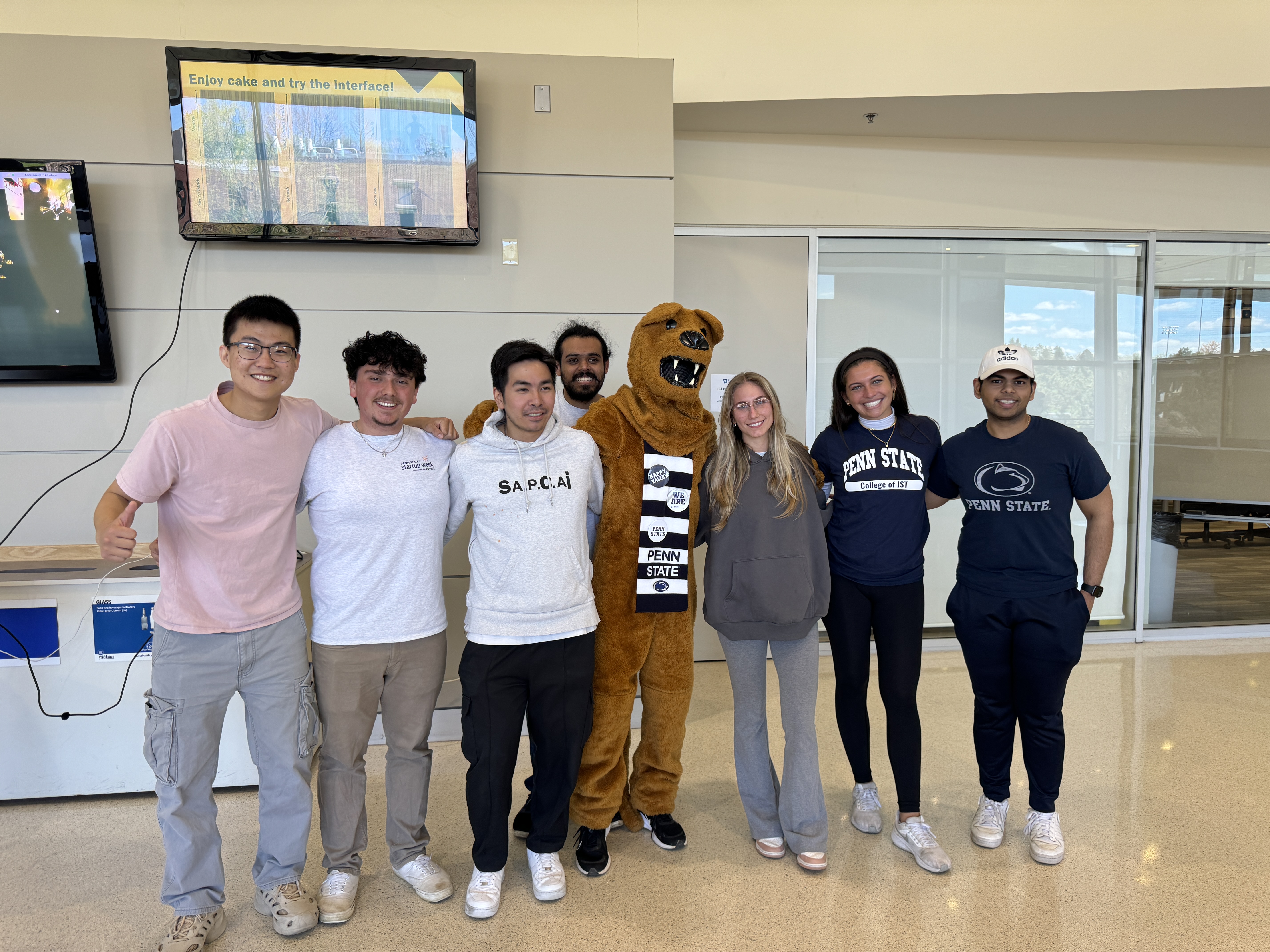 group of college students with lion mascot